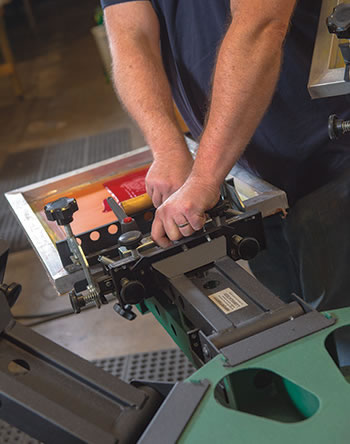 Manual Printing Press Transforms Hobby into High-Wattage Business